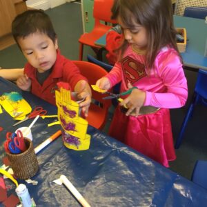 children creating a card cake