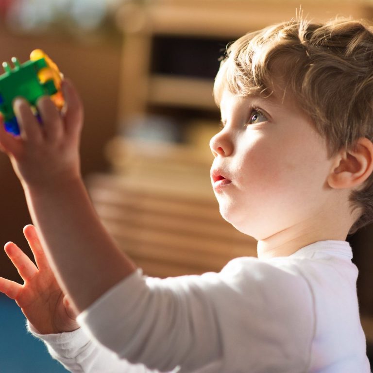 boy holding toy