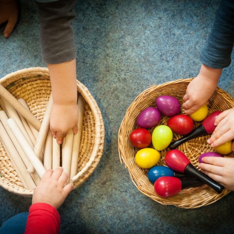 children grabbing percussion toys