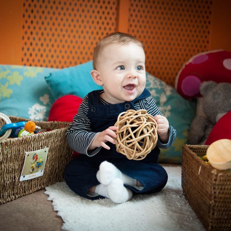 child holding a toy