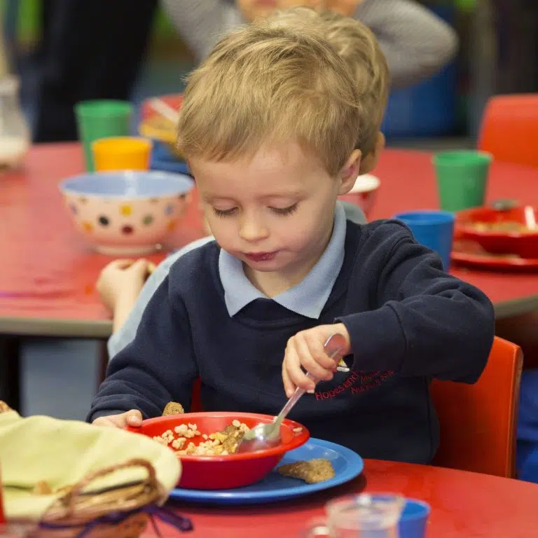 child eating cereal