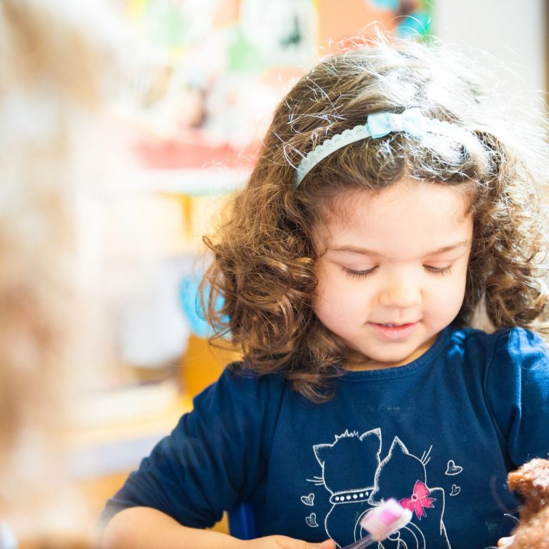 child brushing hair