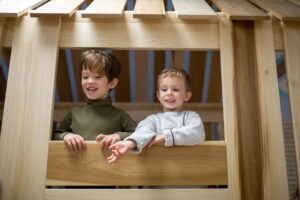 children in a wooden play area